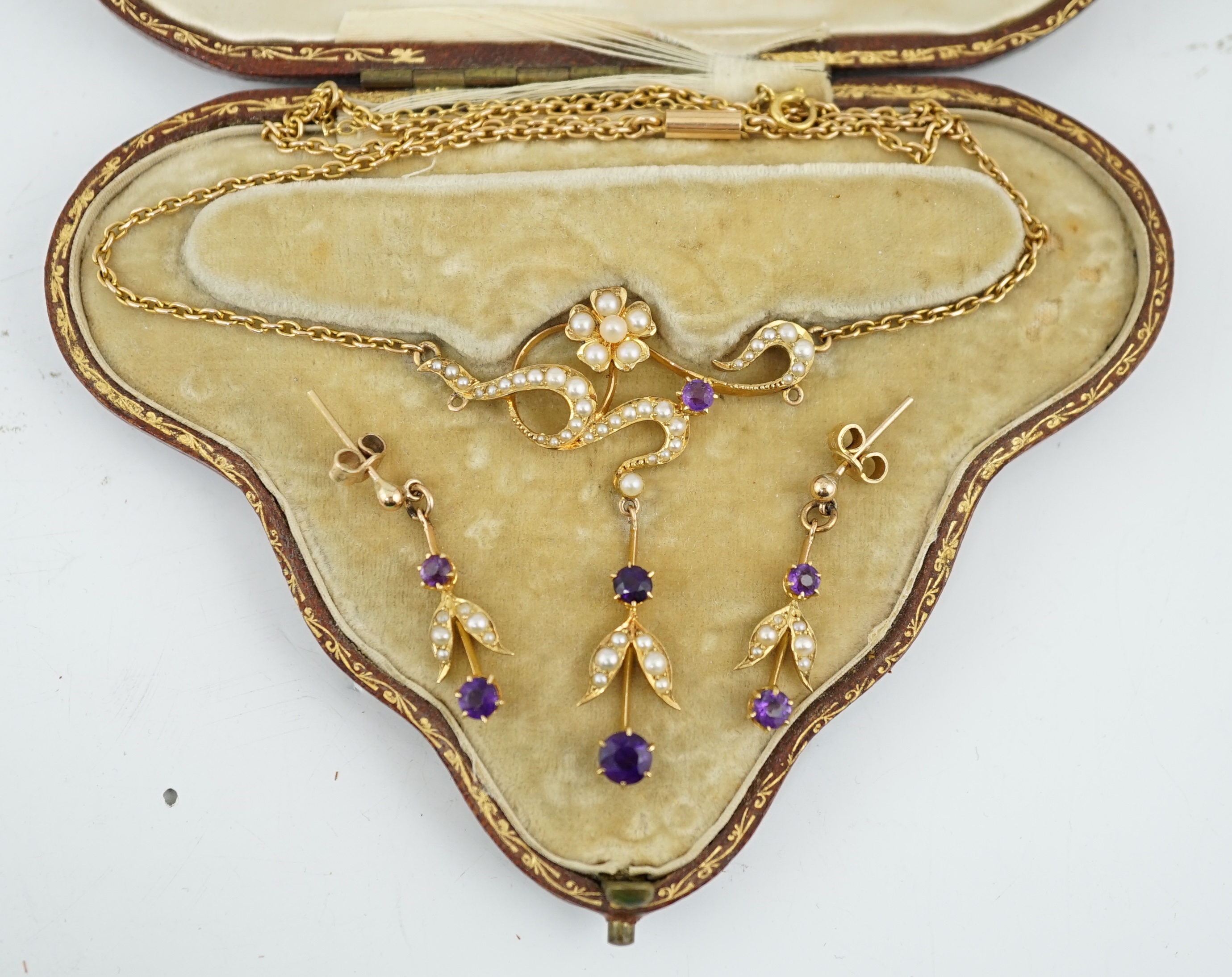 An Edwardian 15ct gold, seed pearl and amethyst set drop necklace and a pair of matching unmarked earrings